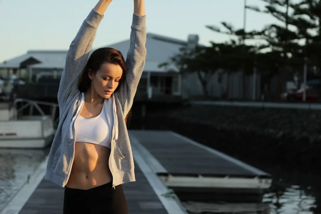 woman exercising outside. Social Media's Impact on Mental Health
