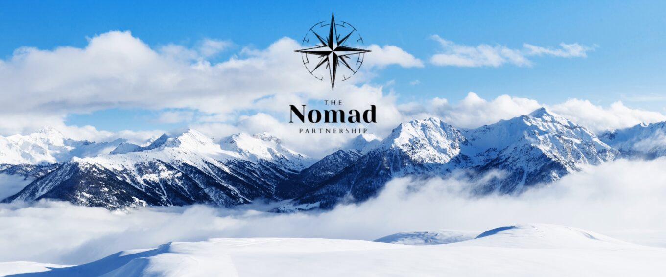 The Nomad Partnership logo on snowy background