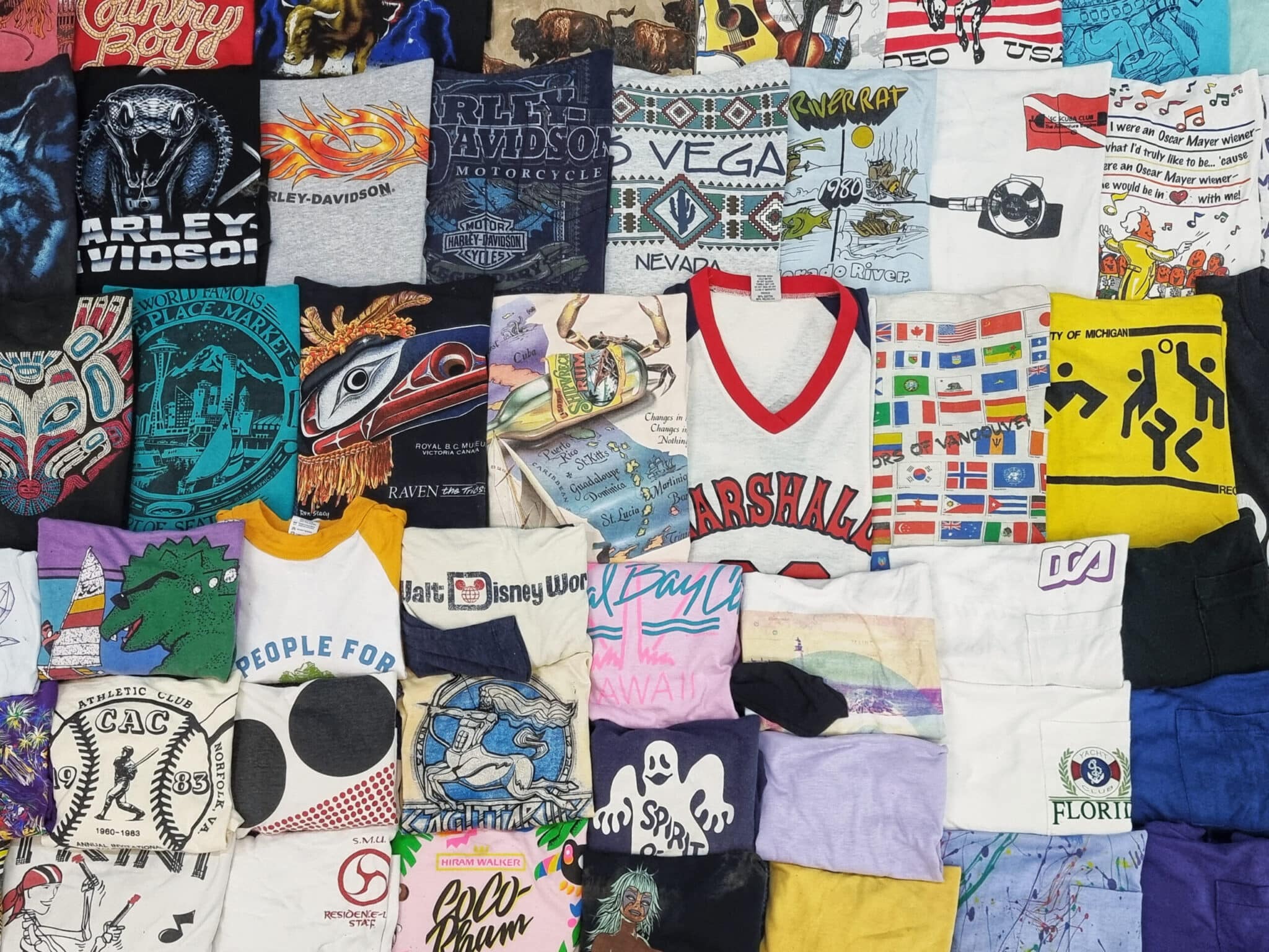 T-Shirts neatly folded and hung at a market in Thailand