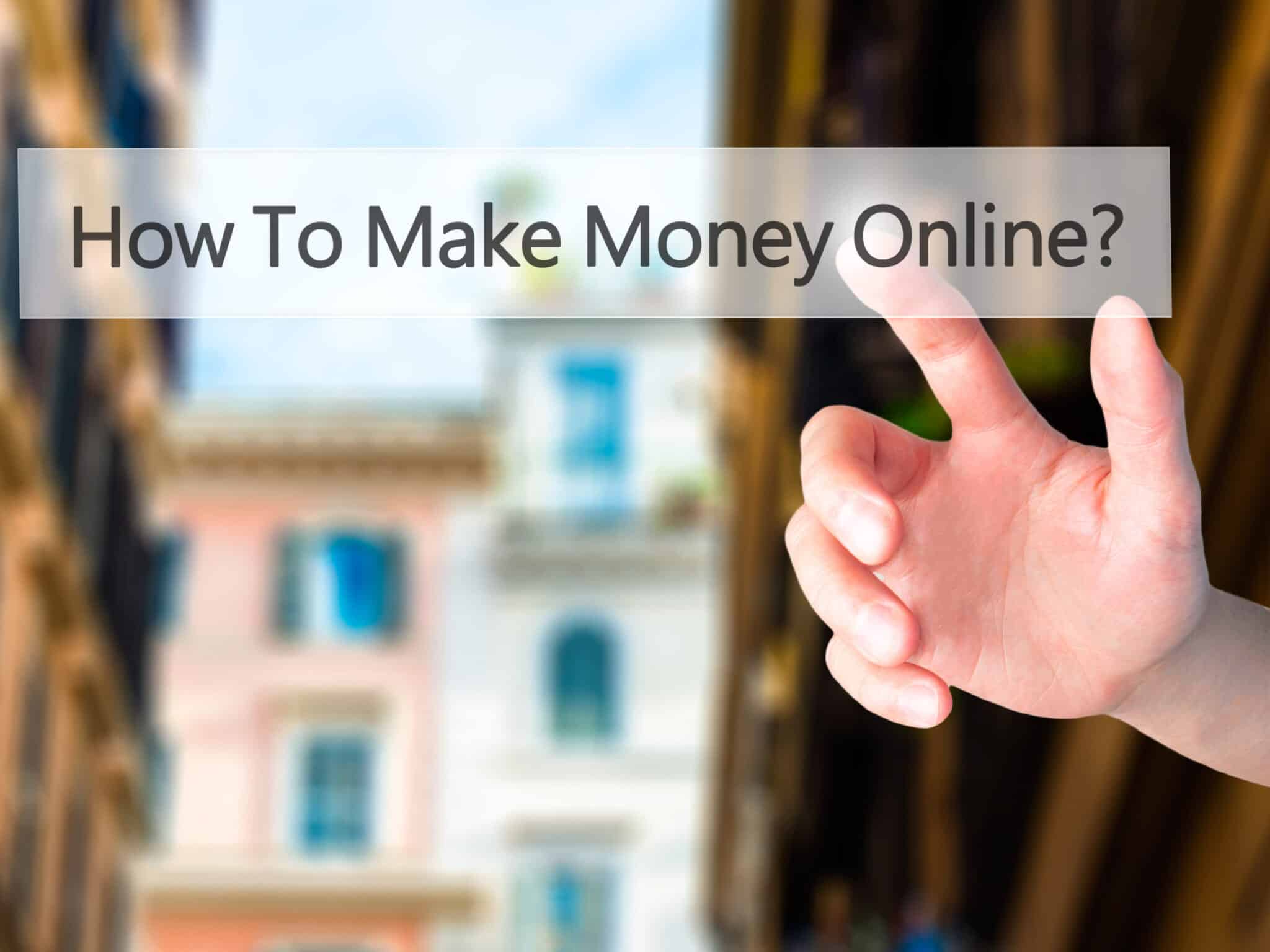 How To Make Money Online - Hand pressing a button on blurred background concept . Business, technology, internet concept. Stock Photo